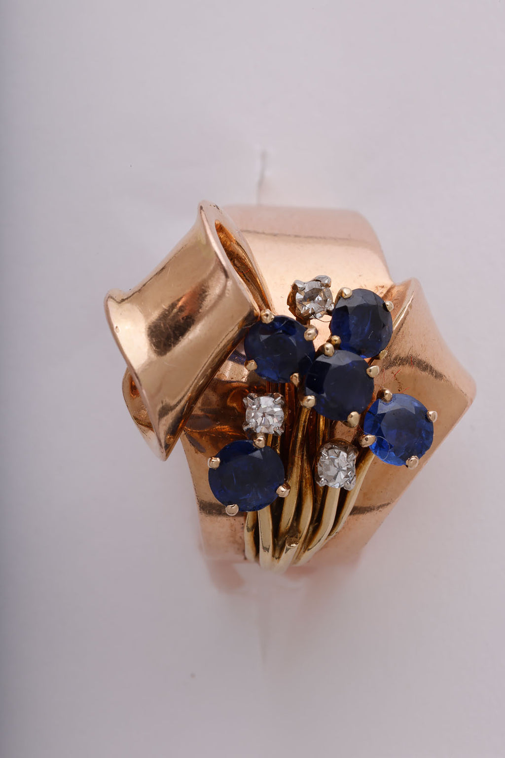 Retro sapphire, diamond, and gold Ribbon Ring